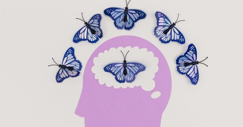 Scalp Massages - Illustration of a Head and Butterflies Around the Scalp and Inside the Brain