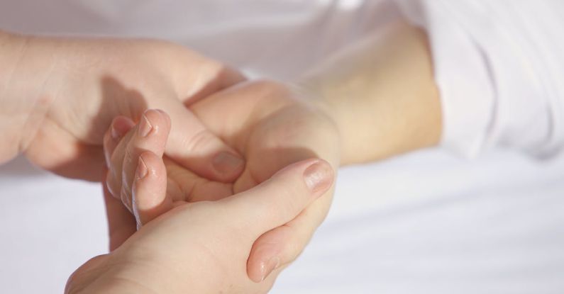 Massage - Person Holding Hand