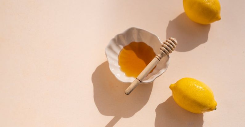 Organic Products - Honey and Lemons on White Studio Background
