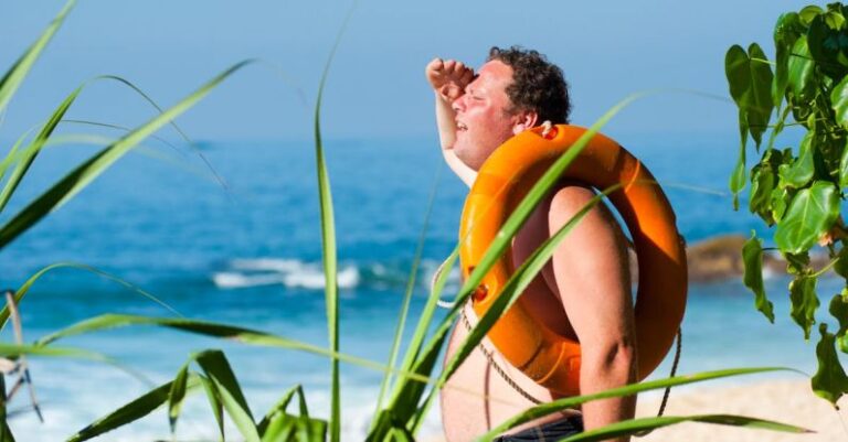 Sunburn - Orange Safety Ring on Man Shoulder Near Body of Water